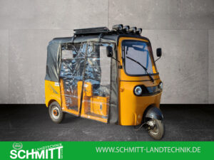 Seitenansicht links mit geschlossenen Folientüren für den vorderen und hinteren Sitzbereich im gelben HIGo